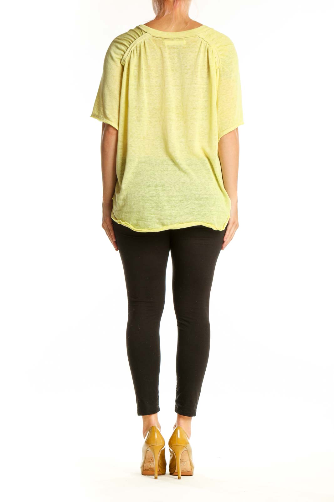 WE THE FREE yellow pocket knit t-shirt back view, oversized casual tee paired with black leggings