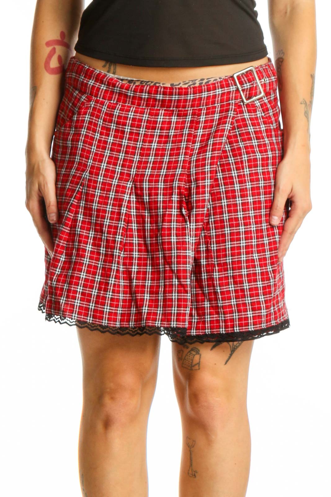 Red and white plaid mini skirt with pleated design and black lace trim, front view