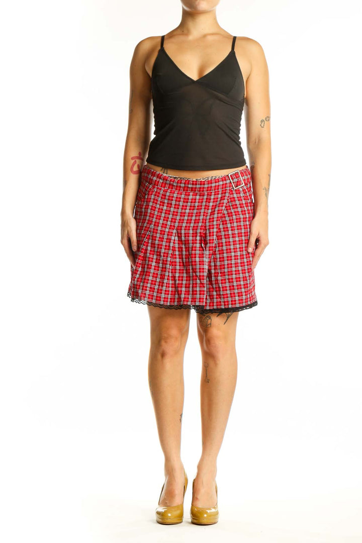 Red and white plaid mini skirt with pleated design and black lace trim, front view