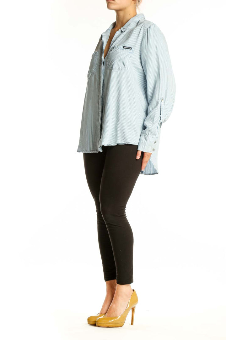 Light blue and white striped Calvin Klein Jeans button-up shirt with collar and long sleeves, front view