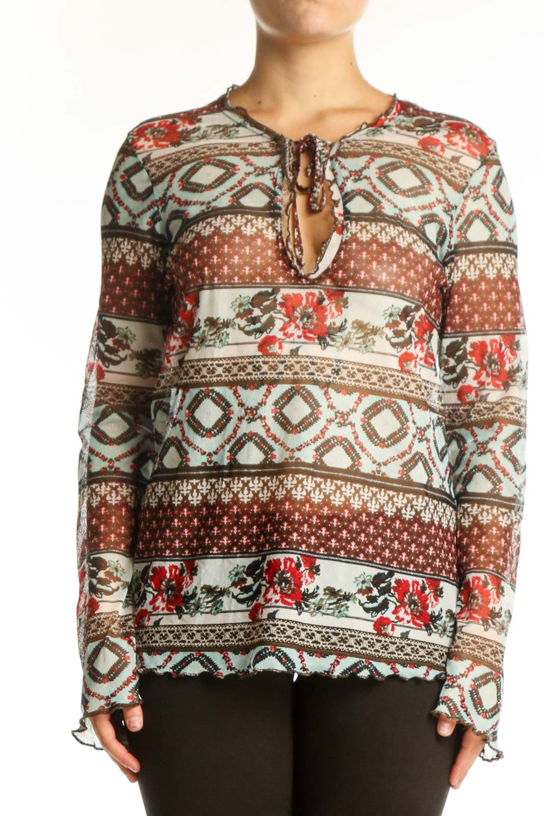 One Touch rust and cream patchwork knit top with floral and geometric patterns, featuring tie-neck detail and long sleeves