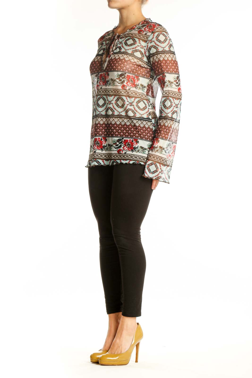 One Touch rust and cream patchwork knit top with floral and geometric patterns, featuring tie-neck detail and long sleeves