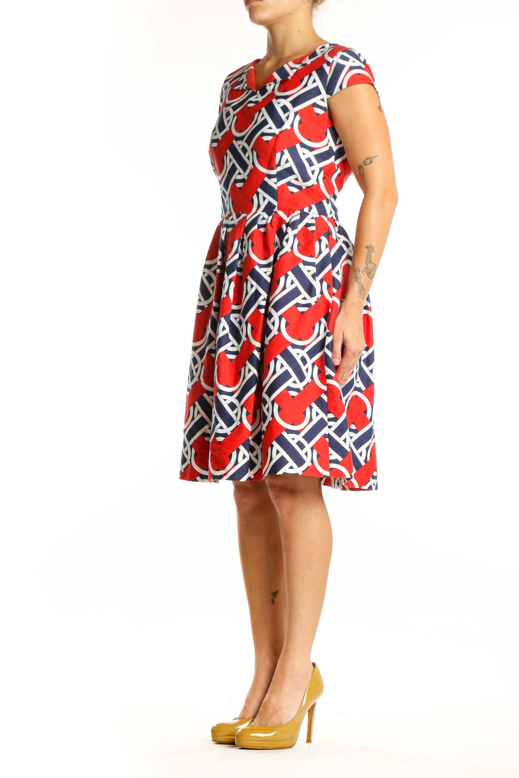 Red, navy, and white geometric print A-line dress with V-neckline and cap sleeves, front view