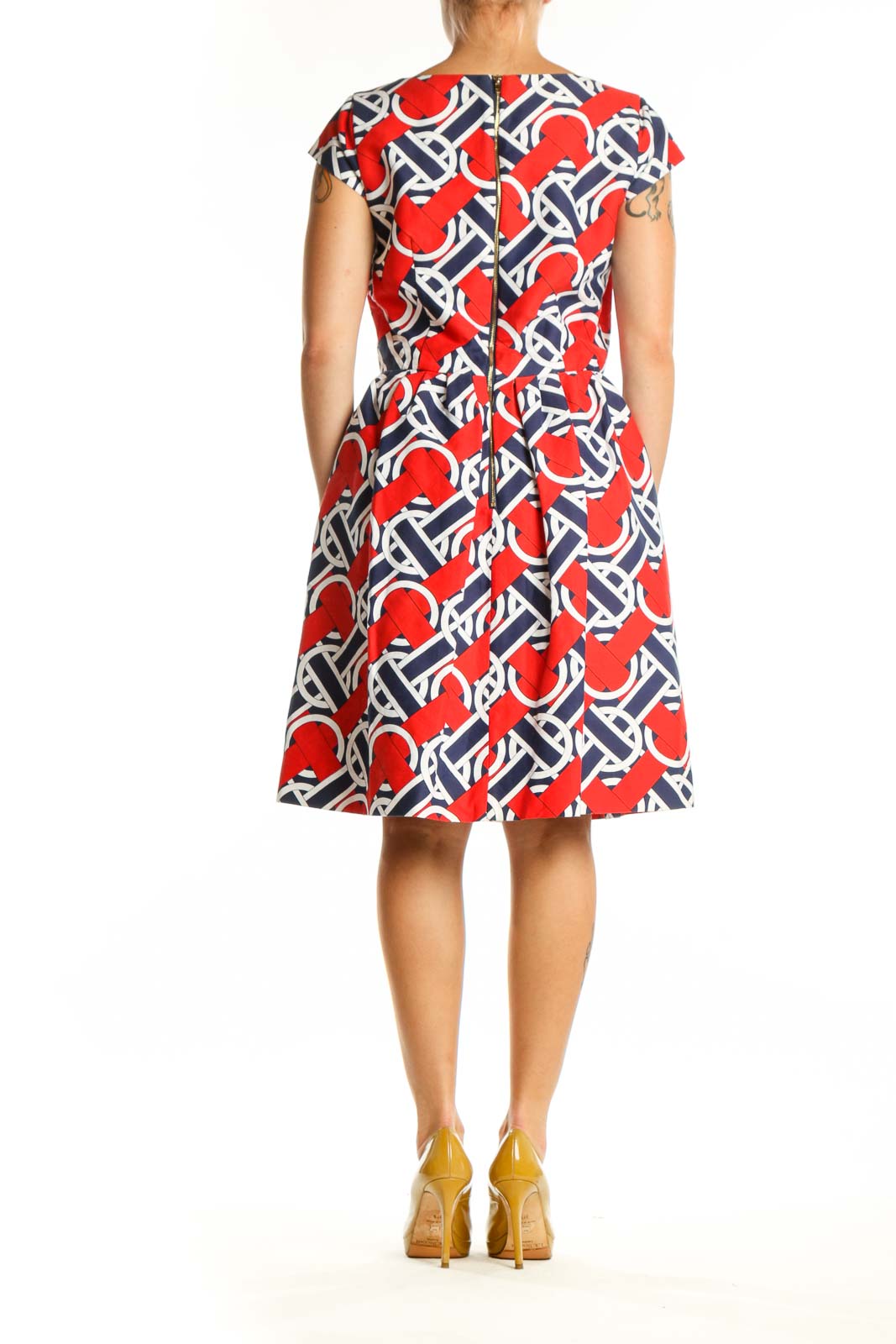 Red, navy, and white geometric print A-line dress with V-neckline and cap sleeves, back view