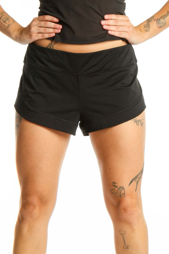 Black athletic shorts with 9-inch inseam, front view showing mid-rise waist and comfortable fit
