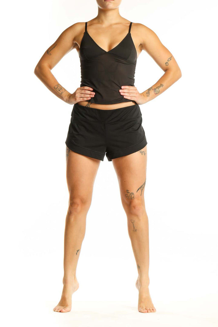 Black athletic shorts with 9-inch inseam, front view showing mid-rise waist and comfortable fit