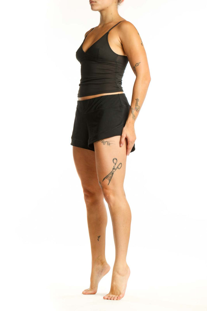 Black athletic shorts with 9-inch inseam, front view showing mid-rise waist and comfortable fit