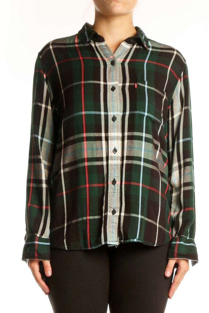 Black plaid flannel shirt with green, red, and cream pattern, button-up front with gray chambray placket, long sleeves