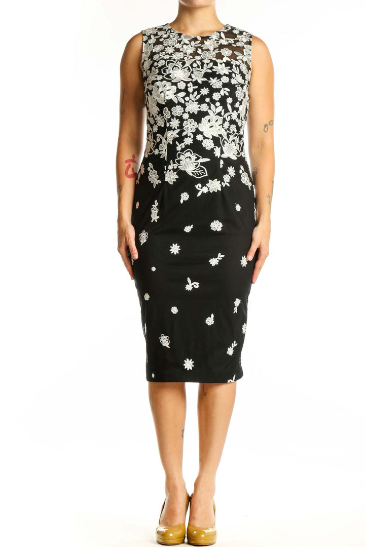 Black floral print midi dress with white ombre design, sleeveless crew neckline, fitted silhouette
