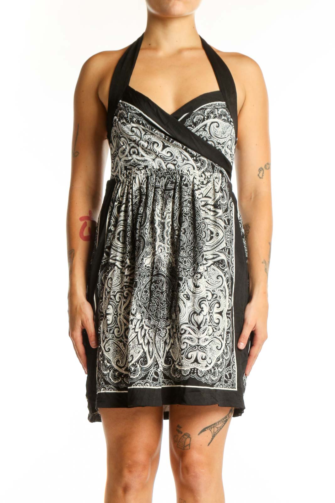 Black and white ornamental halter dress with paisley pattern and wrap-front design, front view
