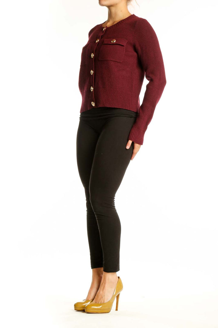 Burgundy ribbed knit cardigan with gold buttons and patch pockets, front view on model
