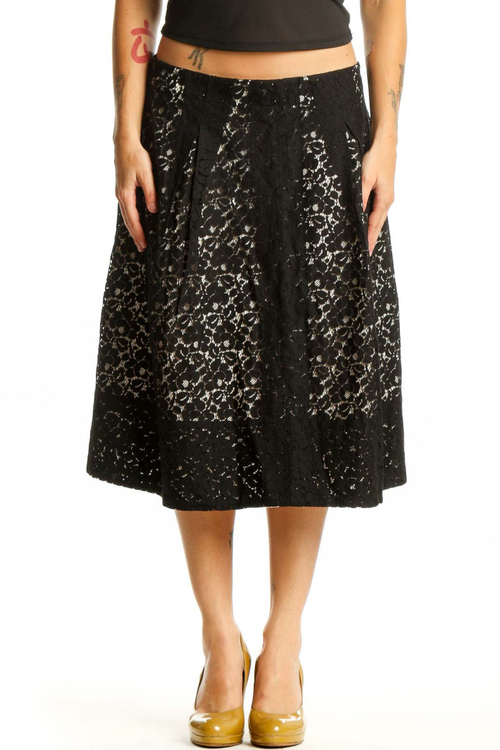 Black lace A-line midi skirt front view, featuring all-over lace pattern and flattering silhouette