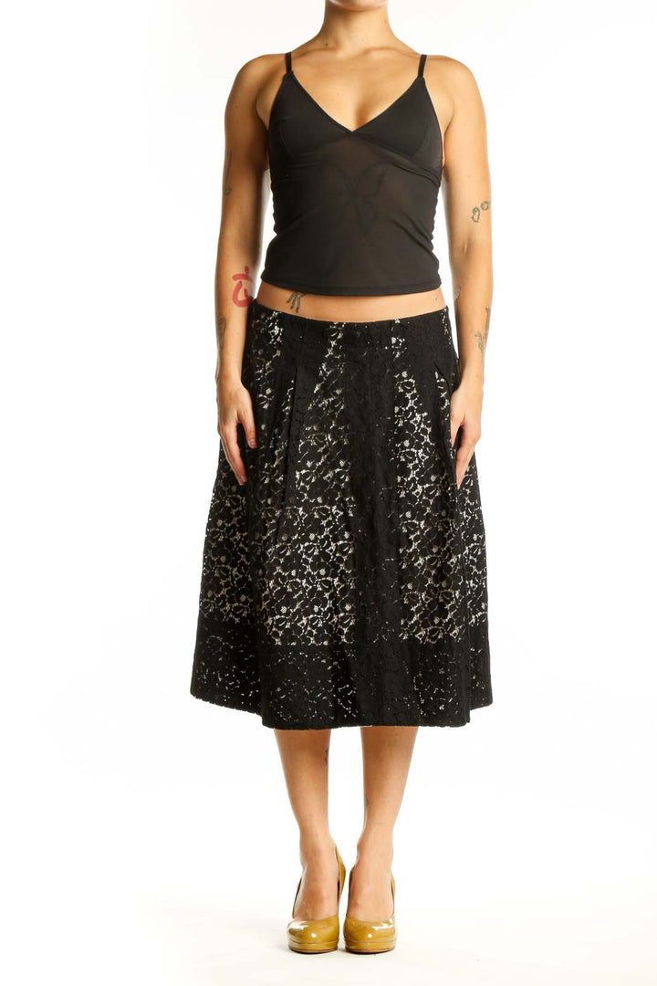Black lace A-line midi skirt front view, featuring all-over lace pattern and flattering silhouette