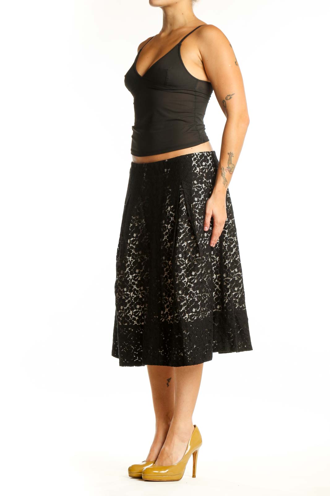 Black lace A-line midi skirt front view, featuring all-over lace pattern and flattering silhouette