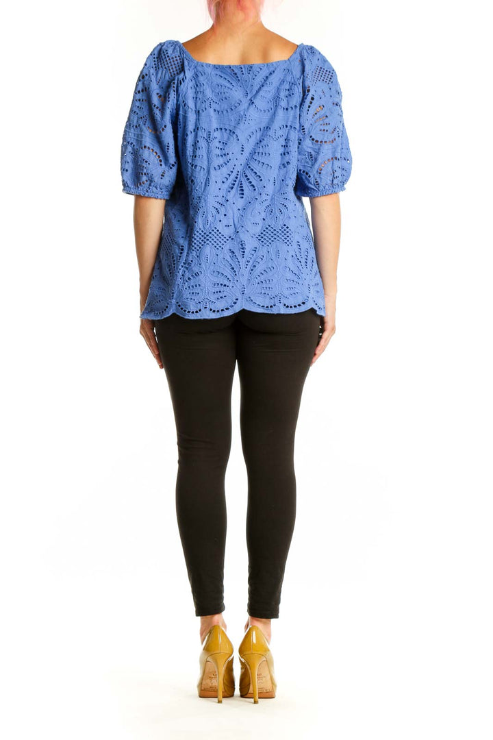 Blue eyelet cotton top with puff sleeves, back view