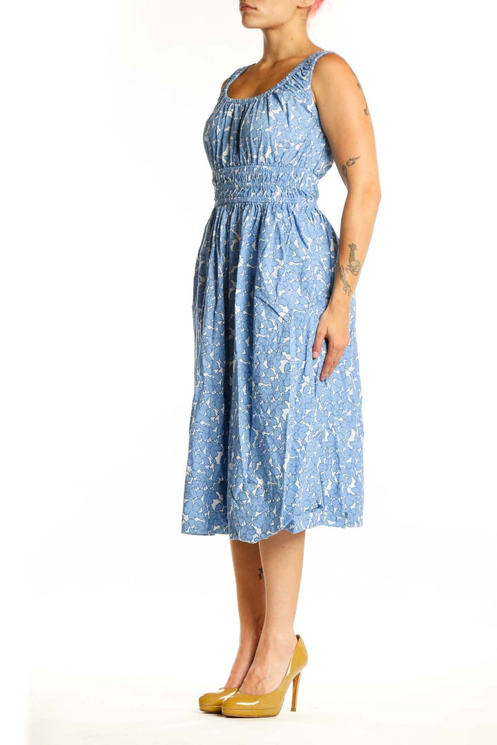 Blue floral cotton midi dress with gathered bodice and elasticized waist, front view