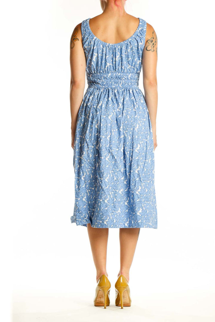 Blue floral cotton midi dress with gathered bodice and elasticized waist, back view
