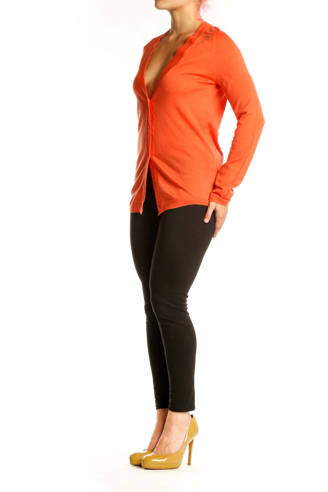 Front view of orange merino wool cardigan with button-front closure and V-neckline