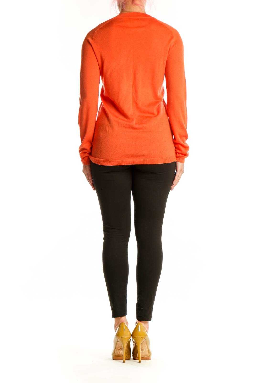 Back view of orange merino wool cardigan showing relaxed fit and ribbed cuffs