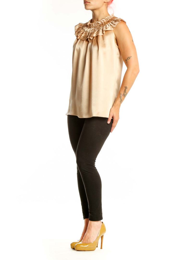 Cream sleeveless blouse with ruffled neckline by Milly, front view