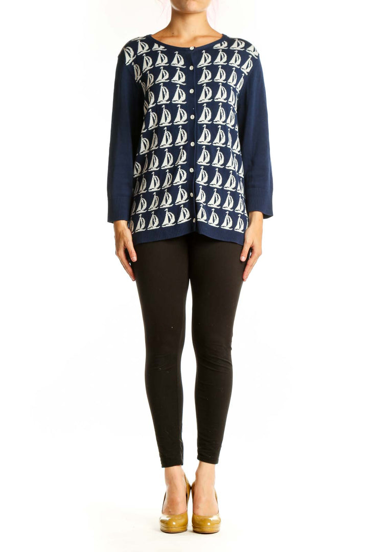 Navy and cream sailboat patterned cotton cardigan with button-front closure and long sleeves