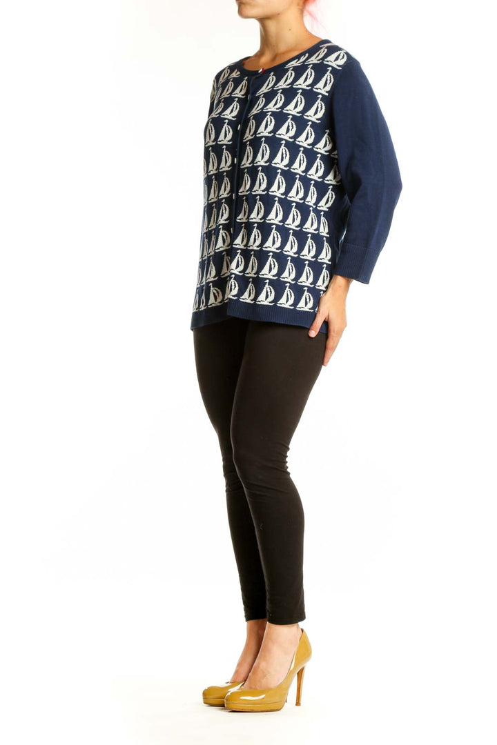 Navy and cream sailboat patterned cotton cardigan with button-front closure and long sleeves