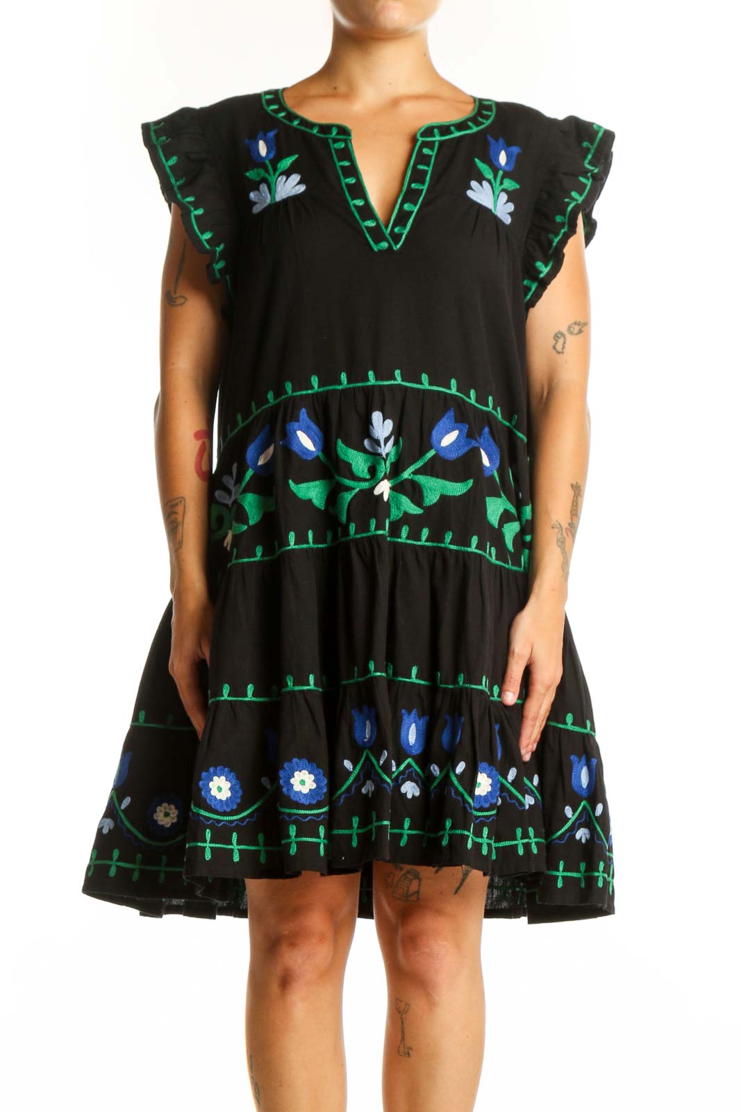 Roller Rabbit black cotton dress with hand-embroidered blue and white floral motifs, tiered silhouette, and flutter sleeves, front view