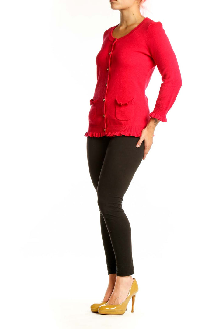 Red cashmere blend cardigan with ruffle trim and gold buttons, front view