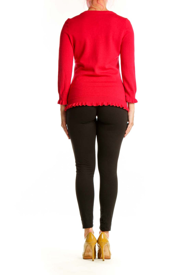 Red cashmere blend cardigan back view showing button closure and ruffle hem detail