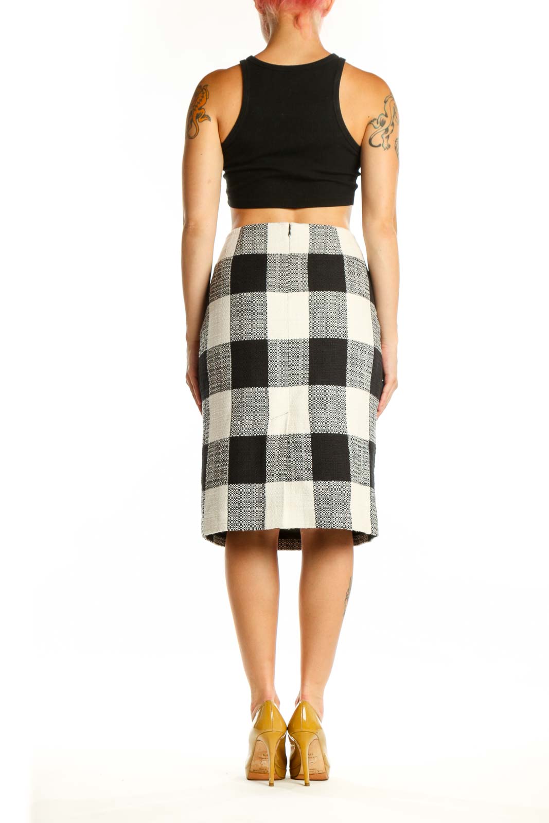 Black and white checkered pencil skirt back view, showing classic straight silhouette