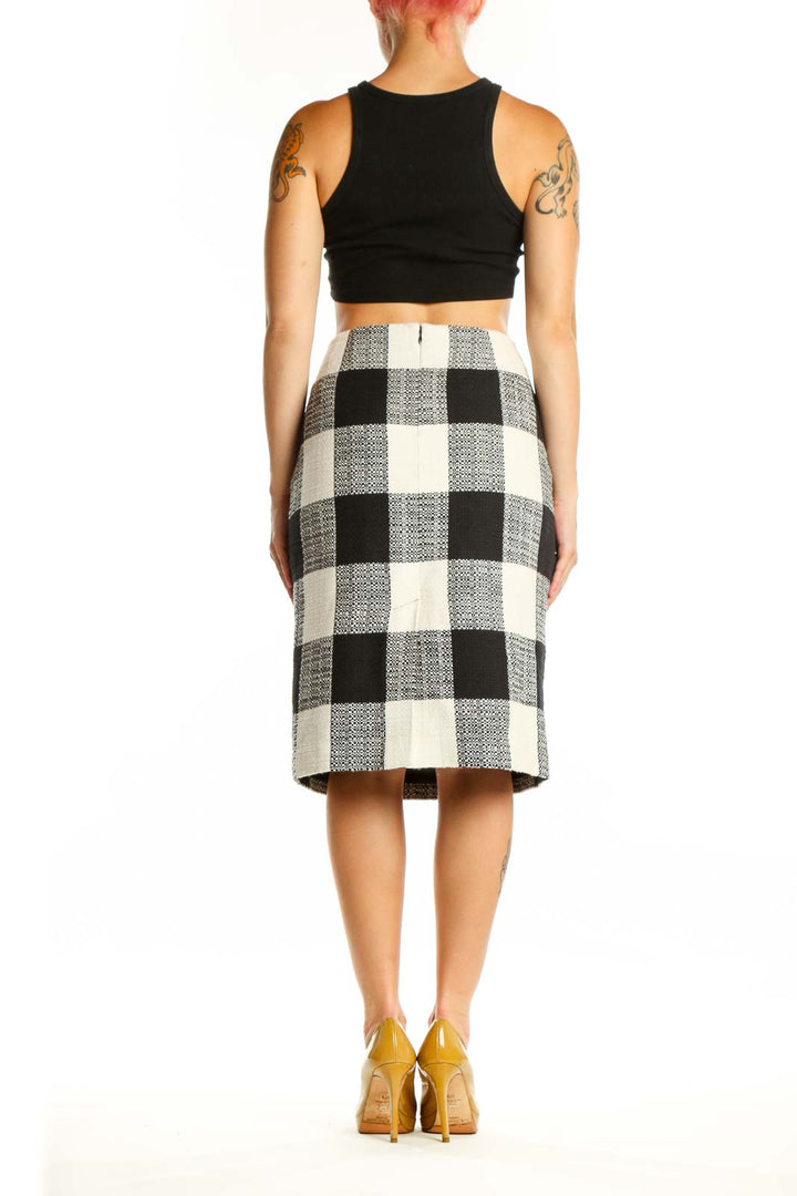 Black and white checkered pencil skirt back view, showing classic straight silhouette