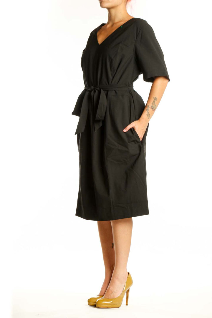 Black wrap midi dress with V-neckline and tie waist, front view on model
