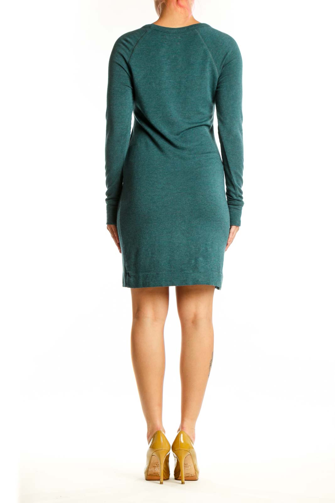 Back view of teal rayon spandex knit dress showing relaxed silhouette and knee length hem