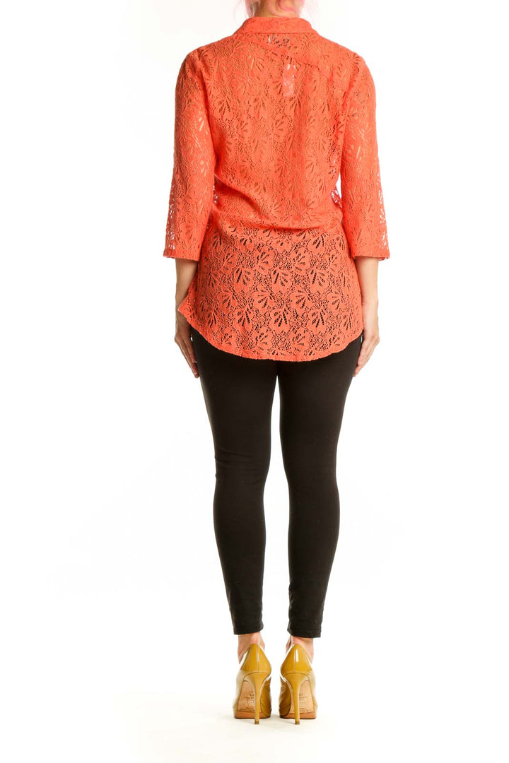 Orange lace button-up shirt back view showing lace detailing and button closure