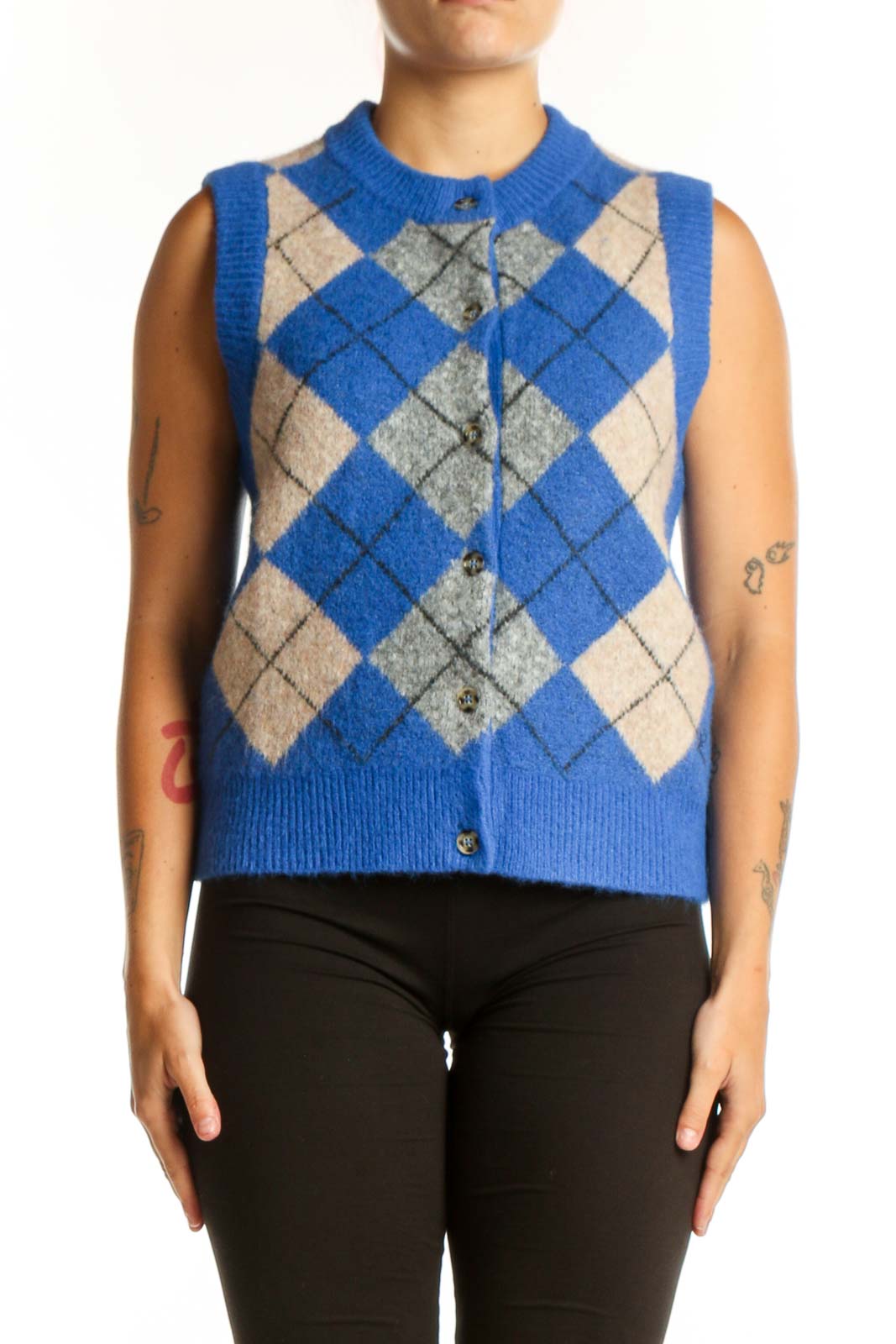 Blue argyle knit vest with cream and gray diamond pattern, crew neckline, button-front closure, worn with black pants