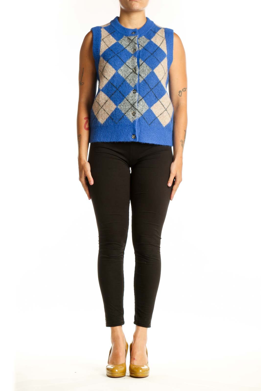 Blue argyle knit vest with cream and gray diamond pattern, crew neckline, button-front closure, worn with black pants