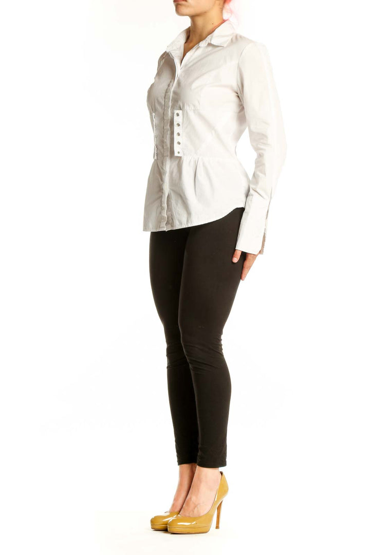 White cotton button-up shirt with ruching detail on front, long sleeves, and collared neckline