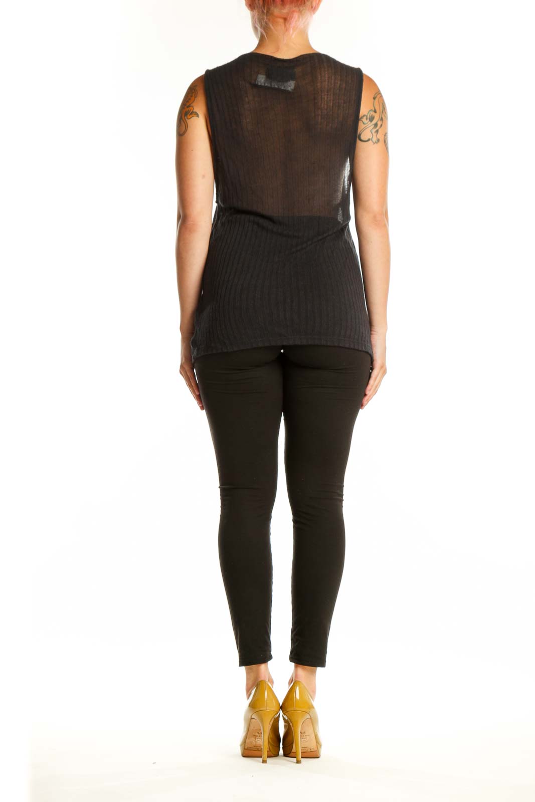 Black ribbed knit tank top back view showing open back design and fitted silhouette