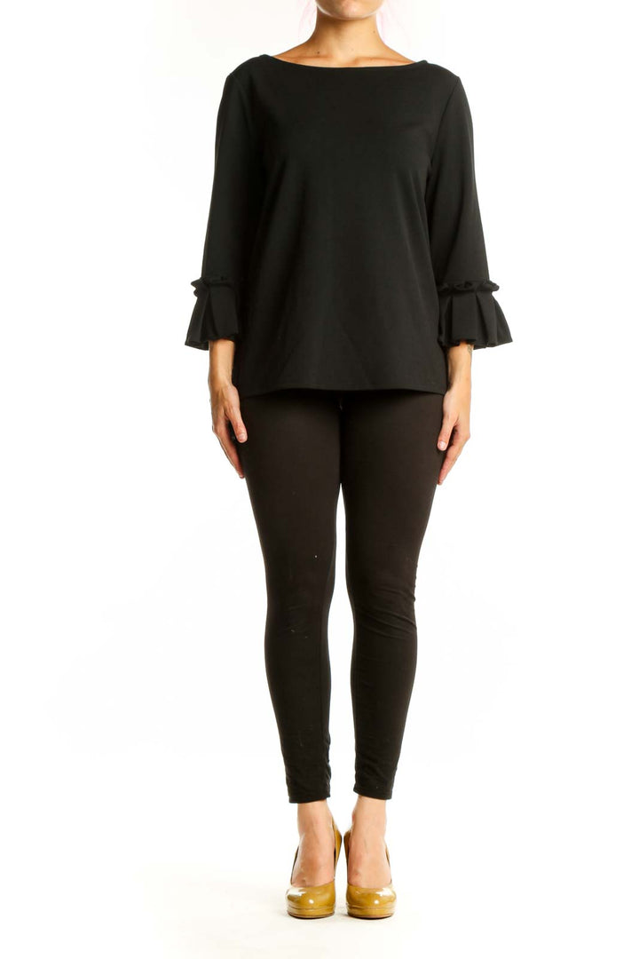 Black ruffle sleeve blouse with boat neckline, front view on model