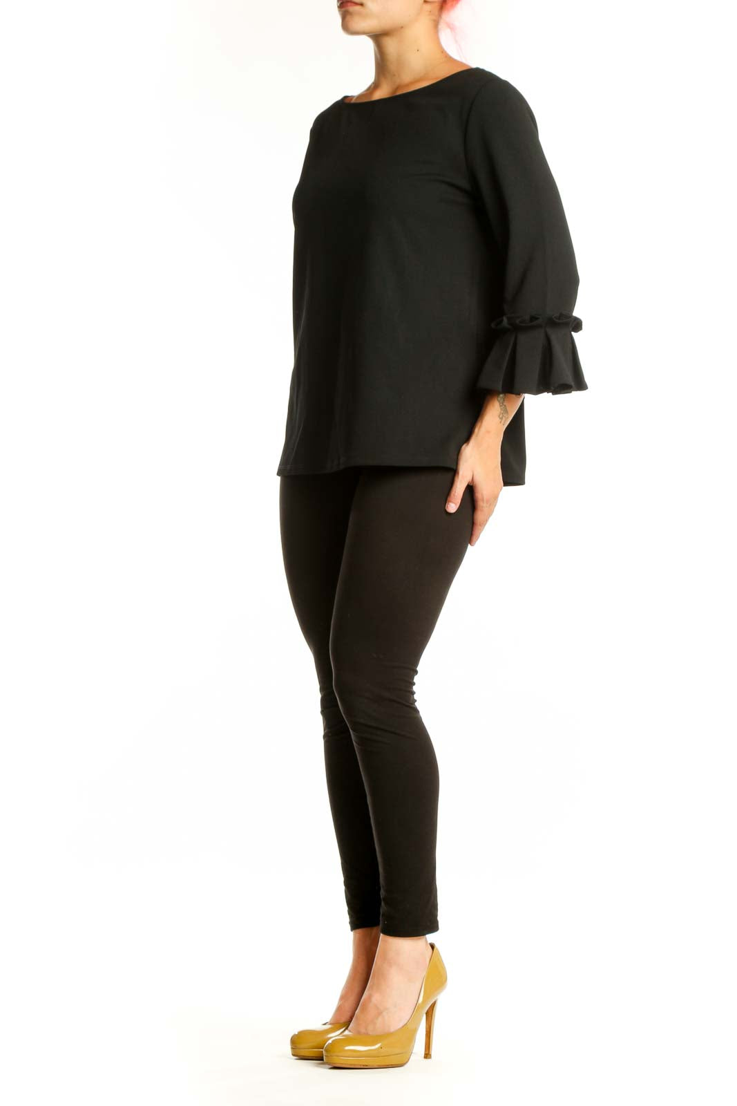 Black ruffle sleeve blouse with boat neckline, front view on model