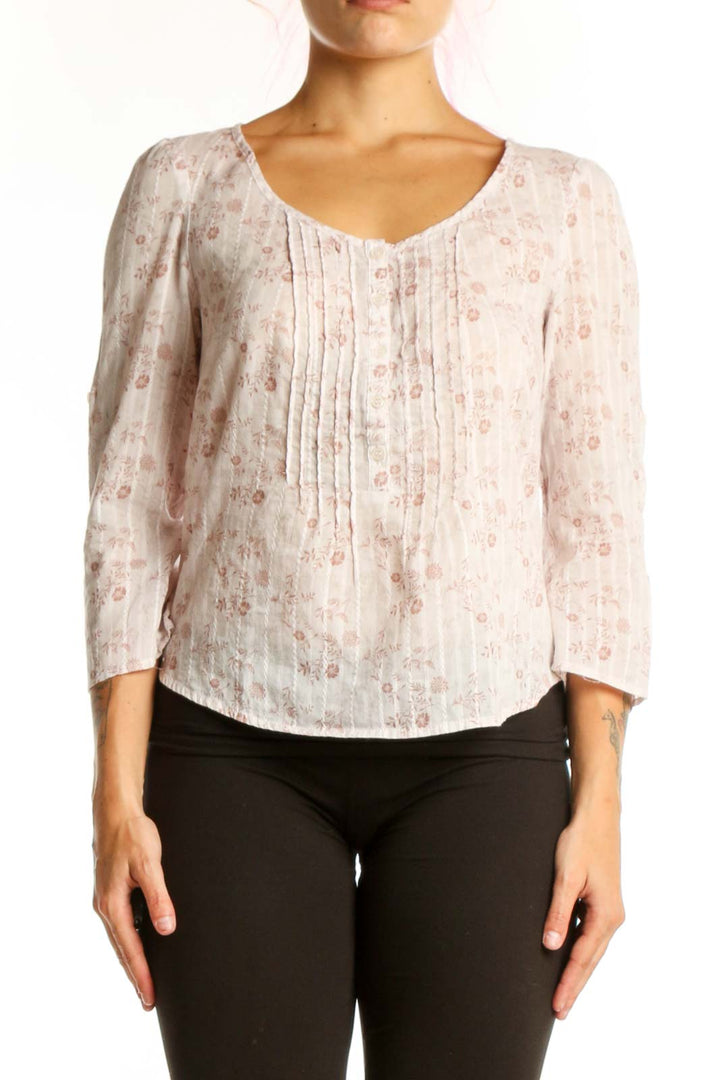 Cream floral pleated cotton top with V-neckline and three-quarter sleeves, front view