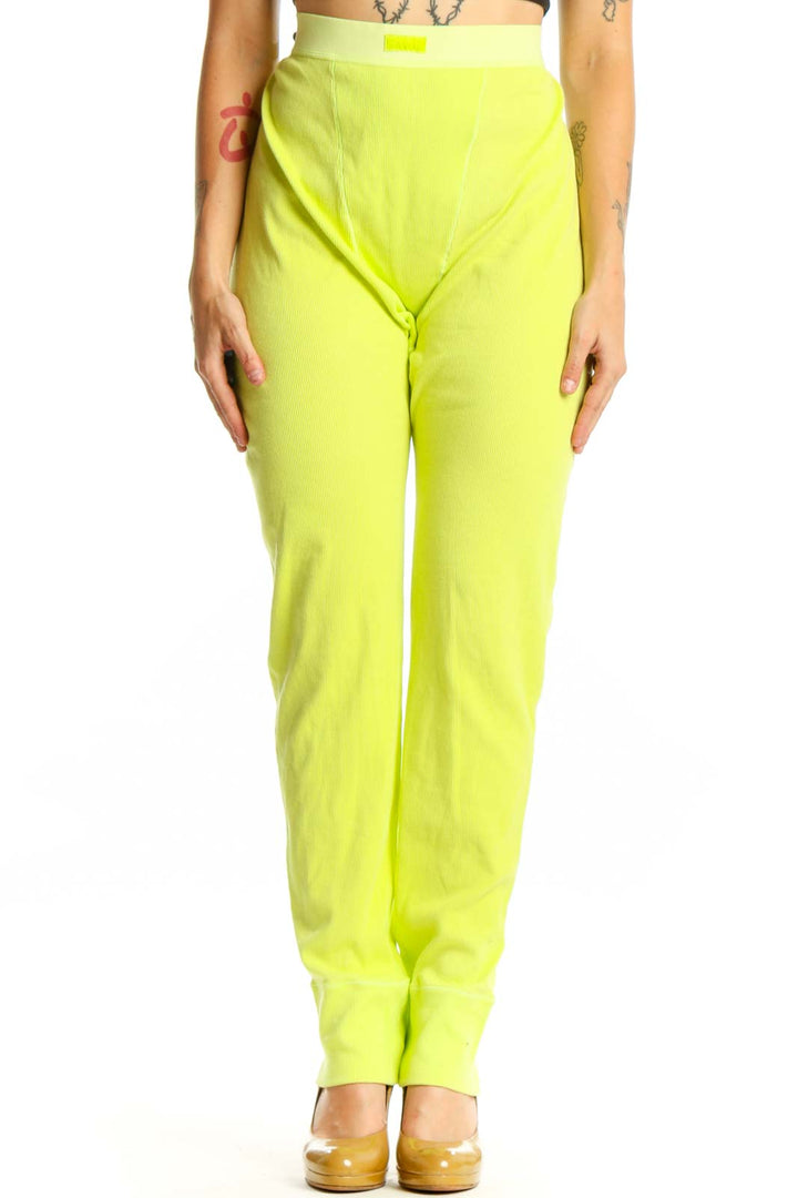 Front view of neon yellow high-waisted stretch pants from Skims in XXL size