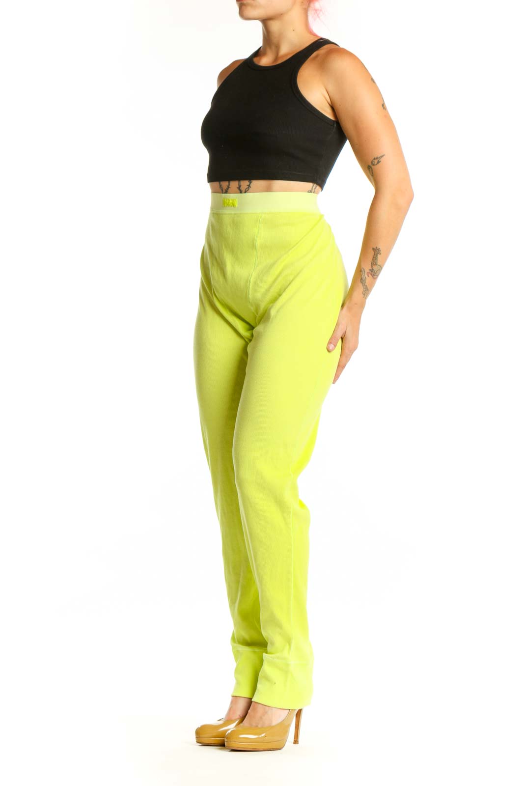 Front view of neon yellow high-waisted stretch pants from Skims in XXL size