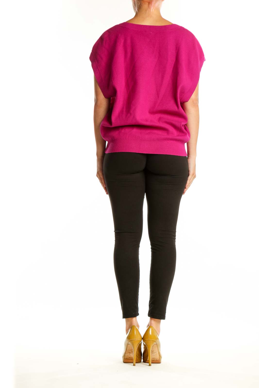 Back view of pink knit vest showing button-front closure and relaxed fit silhouette