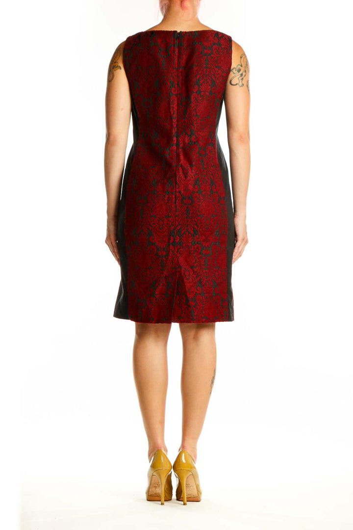 Red damask sleeveless shift dress by Talbots, back view displaying color-block design with black panel detail