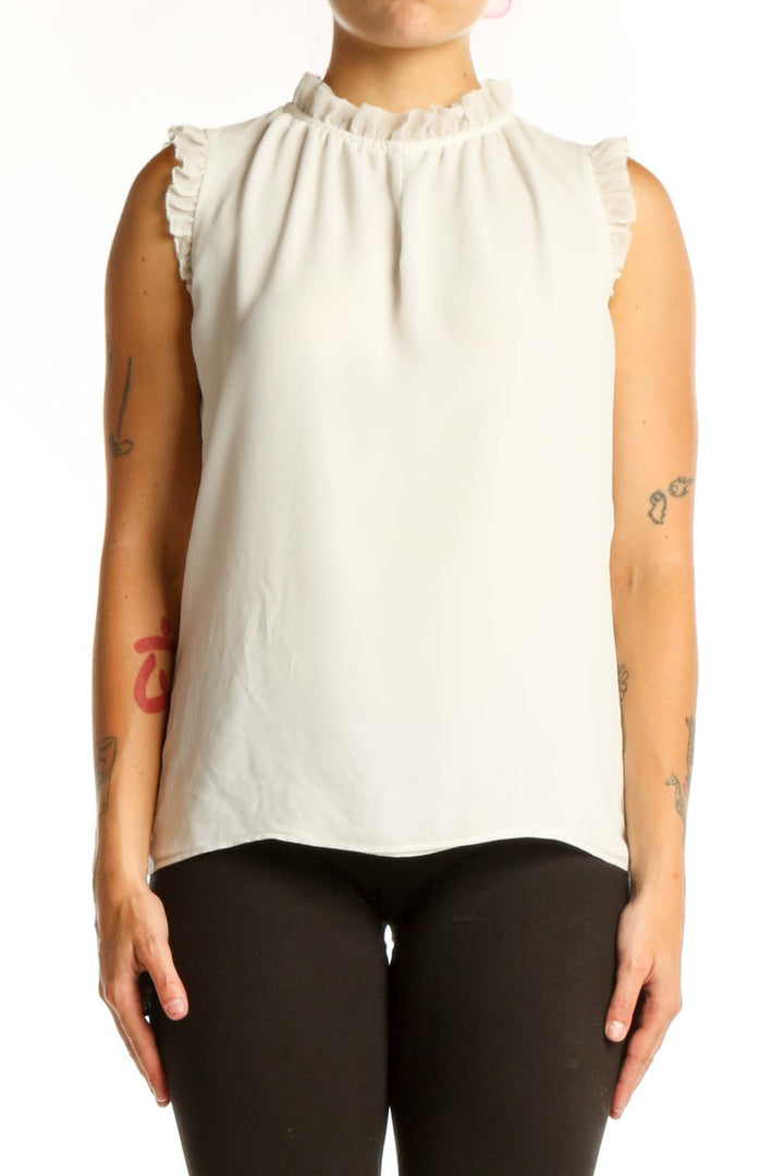 Cream sleeveless top with ruffle shoulder details and crew neckline, front view
