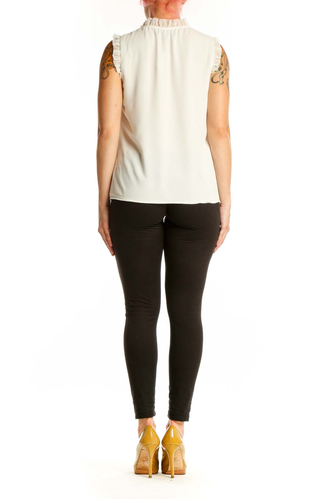 Cream sleeveless top with ruffle shoulder details, back view