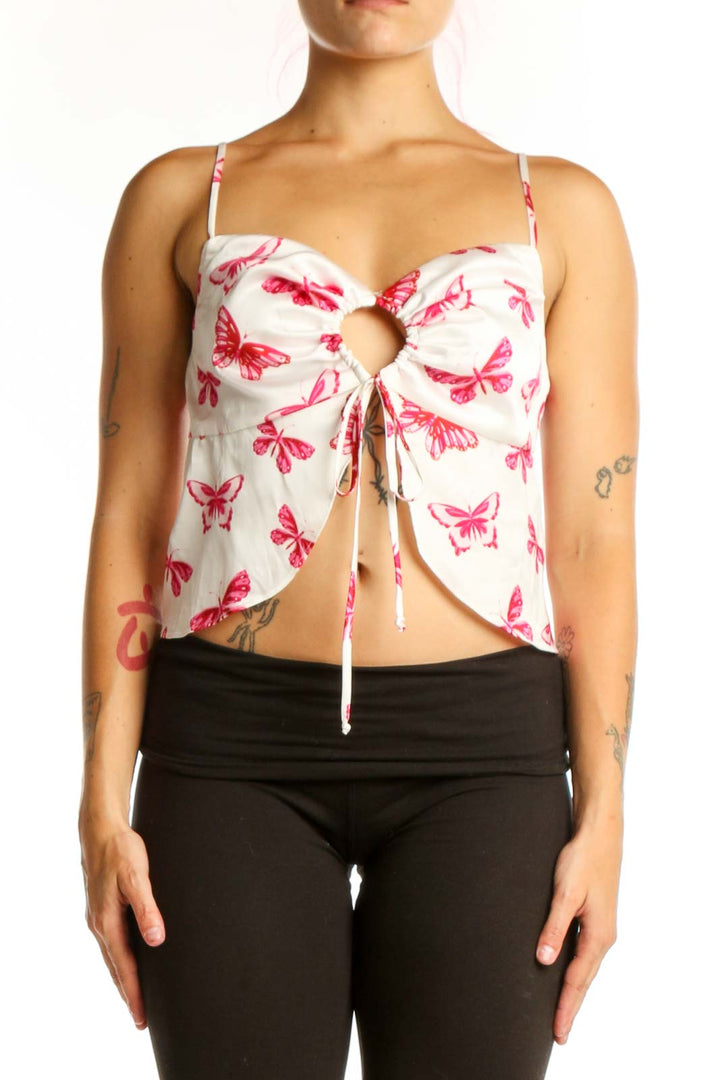 Pink butterfly print crop top with white background and cutout tie-front design, front view