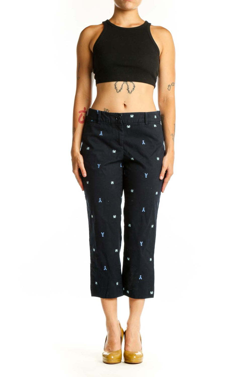 Navy embroidered capri pants with blue and white playful print, front view on model