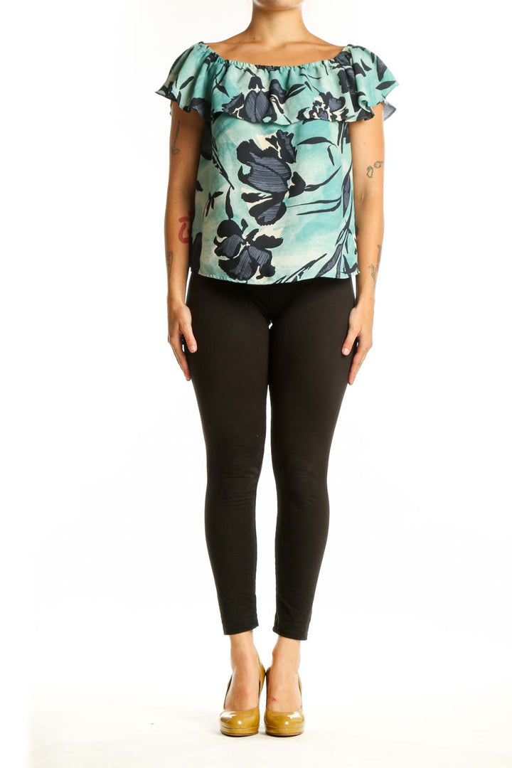 Mint green off-shoulder Maeve top with black floral botanical print and ruffled neckline, front view